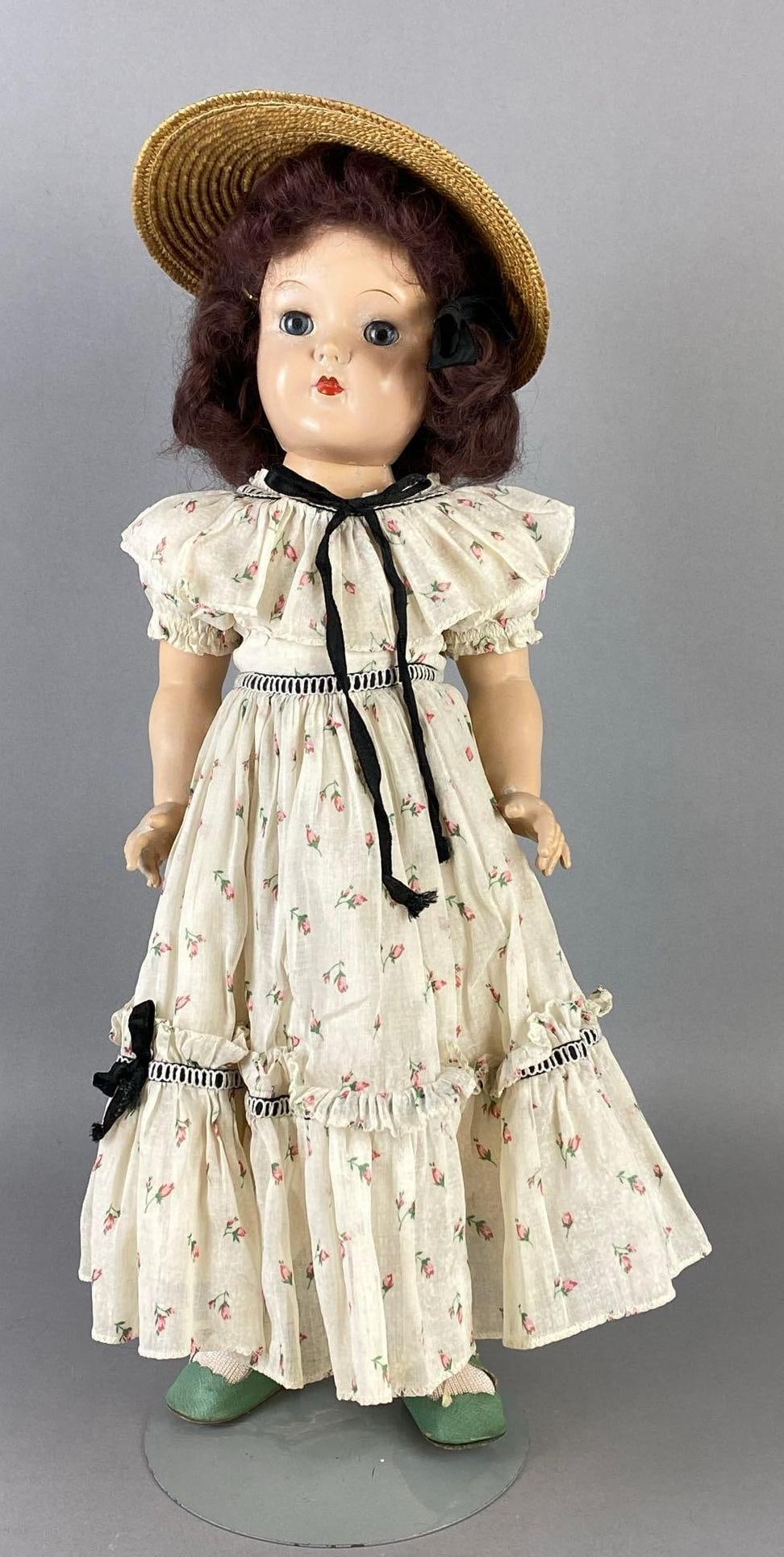 Vintage Ideal Toni P-92 Brunette Doll: Blue sleepy eyes, Some marks around eyes and nose, Neck joint loose, With doll stand, Doll measures 19 inches tall.