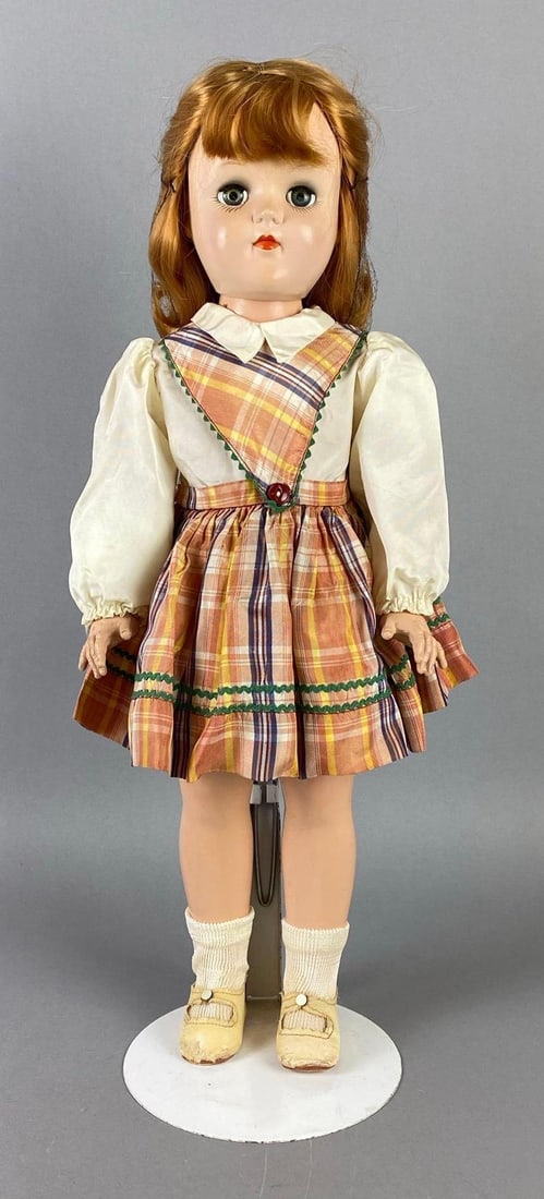 Vintage Ideal Toni P-93 Red Haired Doll: Green sleepy eyes, Small mark on nose, Doll stand included, Doll measures 20 1/2 inches tall.