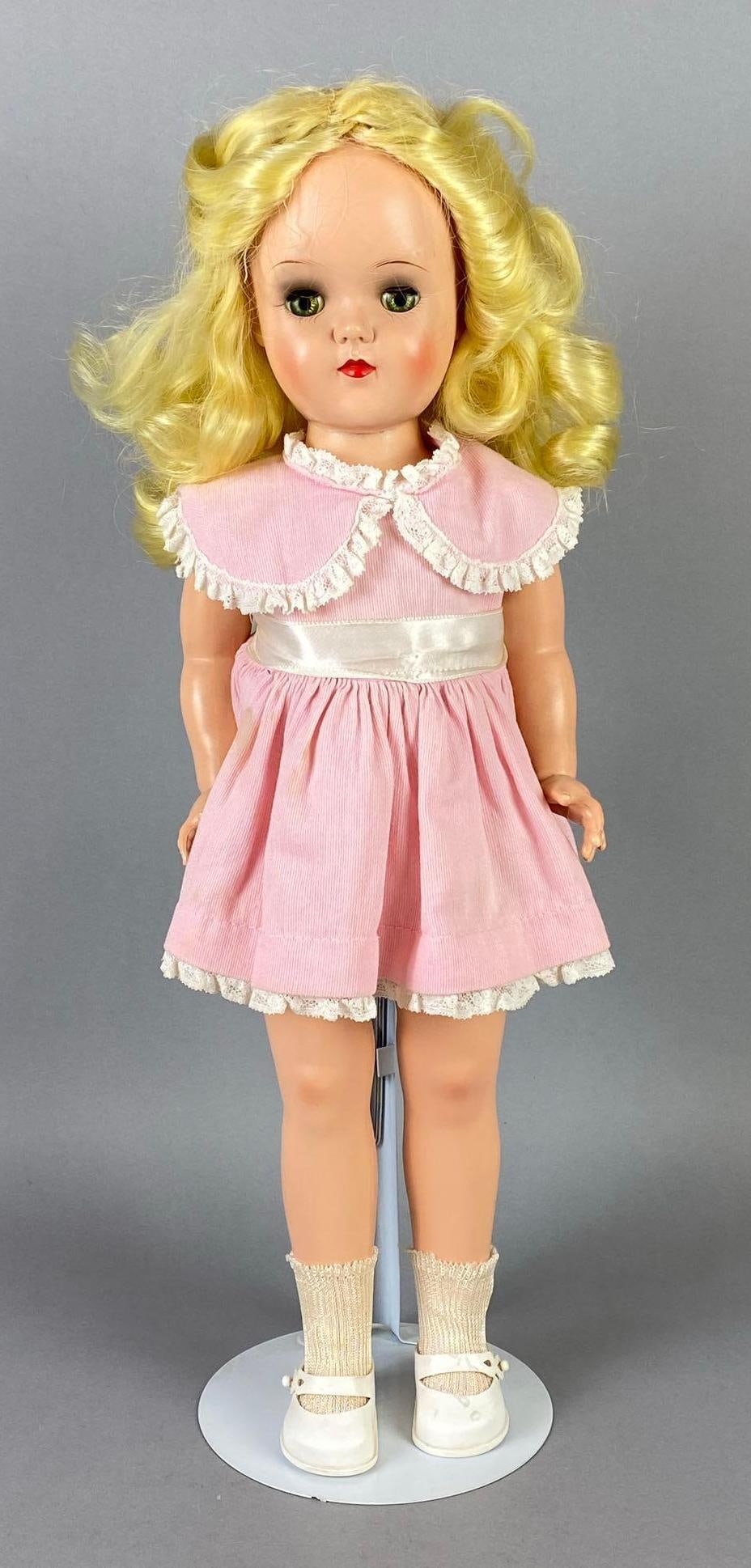 Vintage Ideal Toni P-92 Blonde Walker Doll: Green sleepy eyes, Doll stand included, Doll measures 19 inches tall.