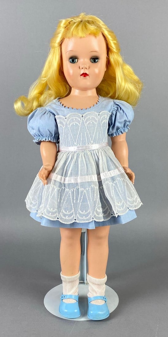 Vintage Ideal Toni P-92 Blonde Doll: Blue sleepy eyes, Doll stand included, Measures 19 inches tall.