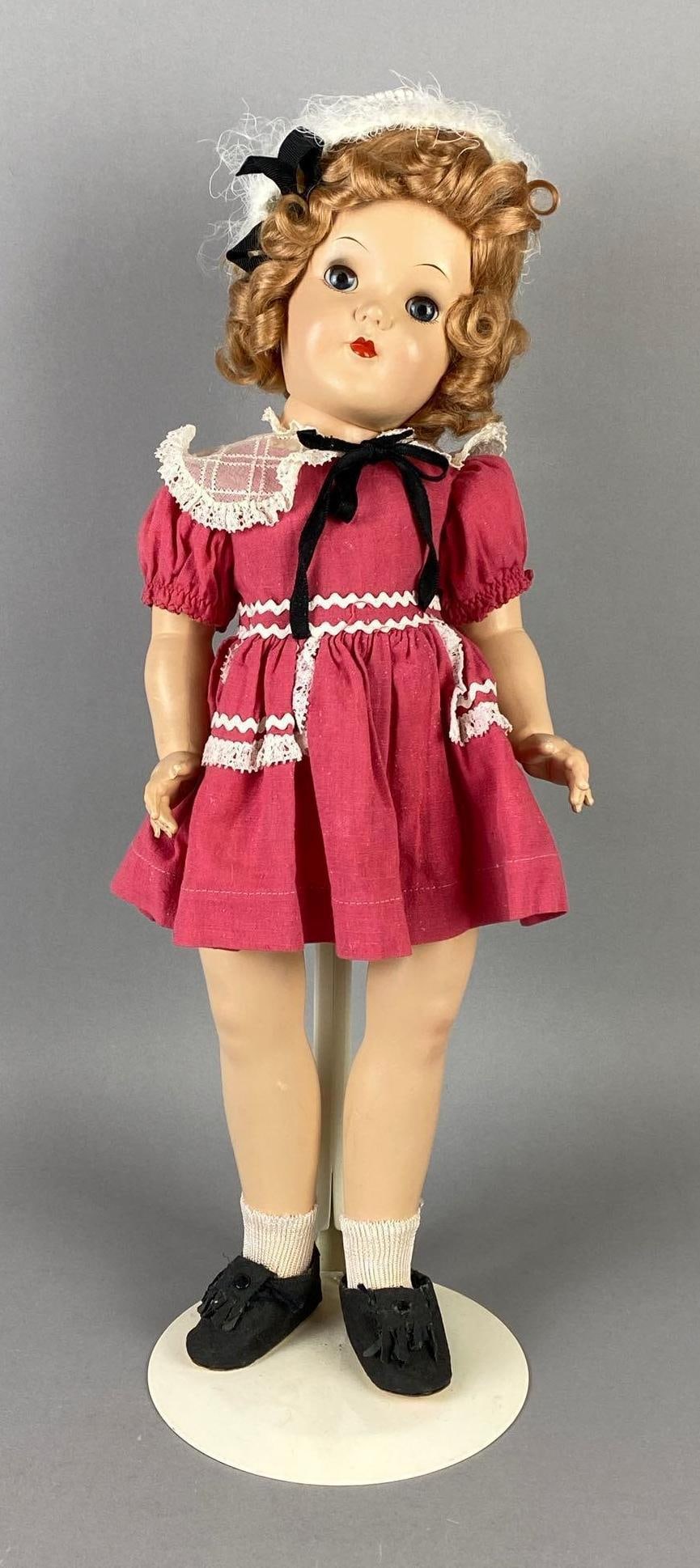 Vintage Ideal Toni P-92 Brunette Doll: Blue sleepy eyes, Neck loose, Doll stand included, Doll measures 19 inches tall.