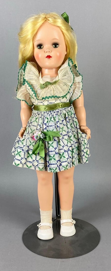 Vintage Ideal Toni P-92 Blonde Doll: Green sleepy eyes, Doll stand included, Doll measures 19 inches tall.