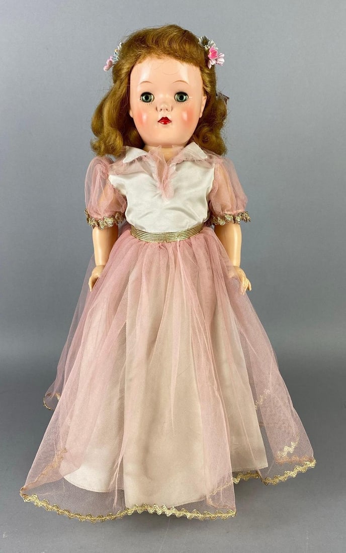 Vintage Ideal Toni P-92 Blonde Hair Doll: Green sleepy eyes, Some yellowing in eyes, Back of dolls head split, Doll stand included, Doll measures 18 1/2 inches tall.