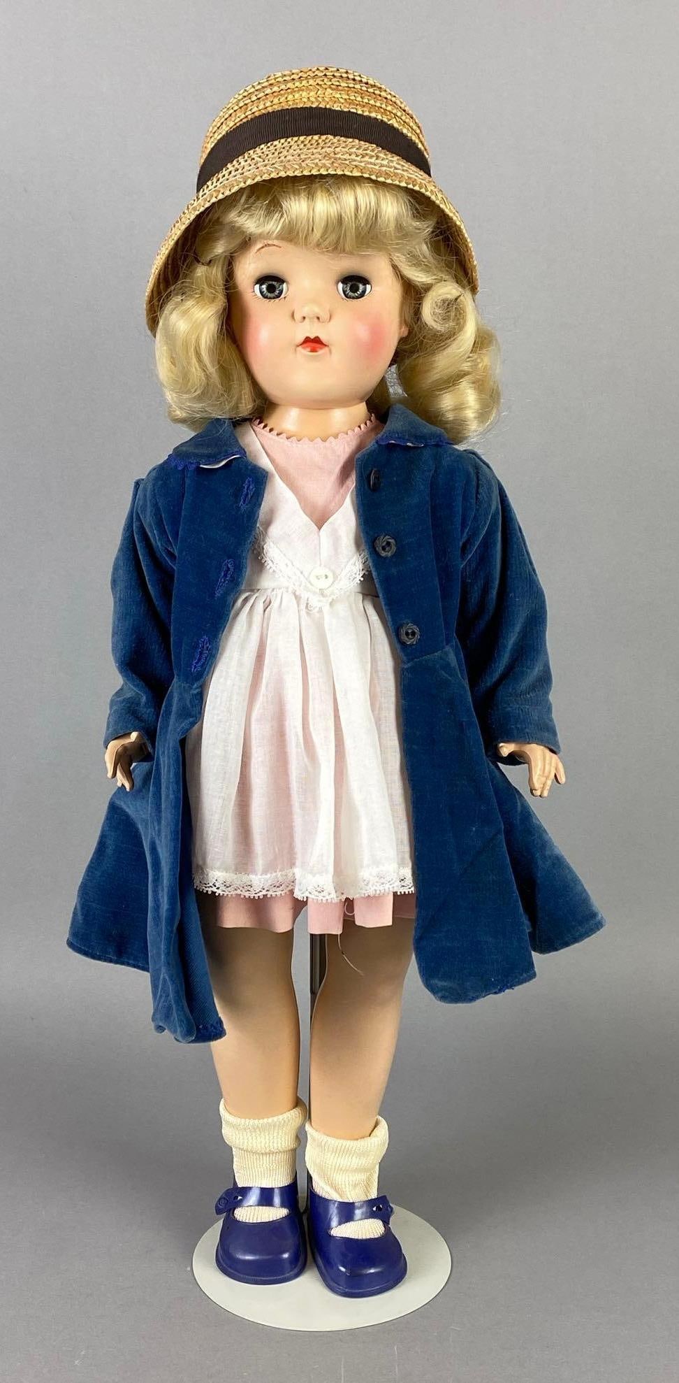 Vintage Ideal Toni P-92 Blonde Doll: Blue-Green sleepy eyes, Neck loose, Doll stand included, Doll measures 19 inches tall.