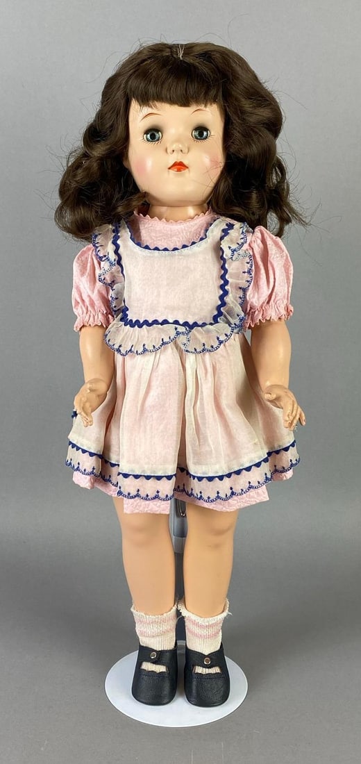 Vintage Ideal Toni P-92 Brunette Doll: Blue sleepy eyes, Doll stand included, Doll measures 19 inches tall.