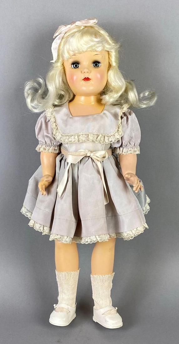 Vintage Ideal Toni P-92 Blonde Doll: Blue sleepy eyes, Neck loose, Doll measures 19 inches tall.