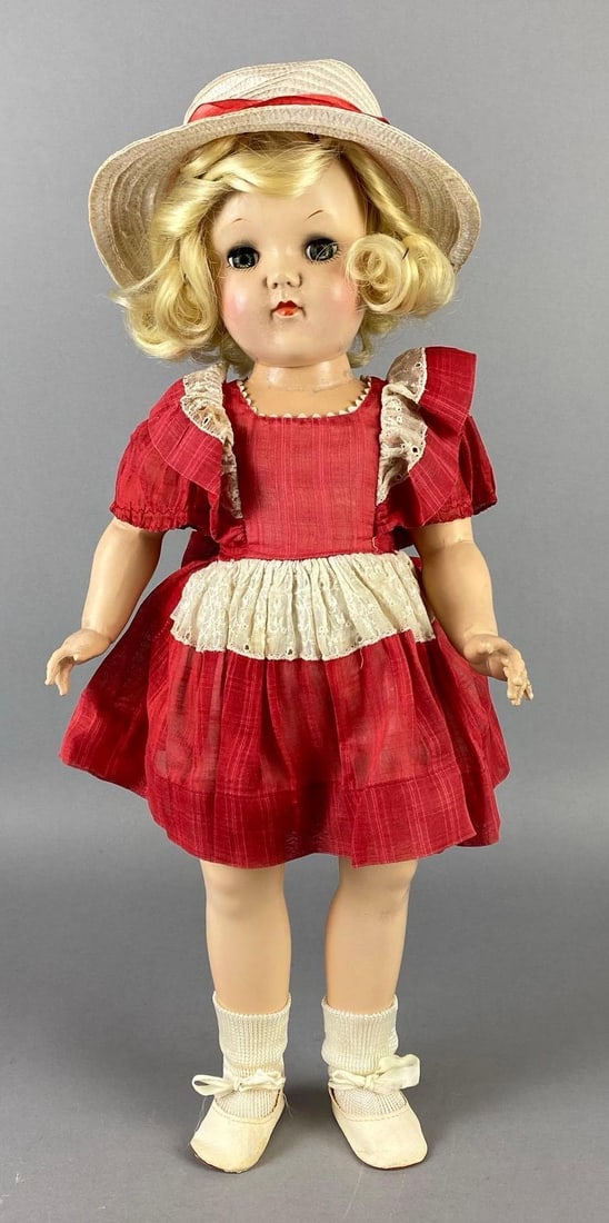 Vintage Ideal Toni P-92 Blonde Doll: Blue-Green sleepy eyes, Some discoloration on face abs neck, Some hair loss, Small crack on one arm, Doll measures 19 inches tall.