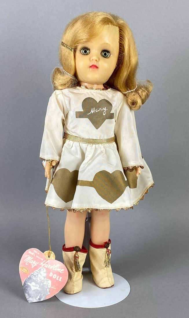 Vintage Ideal Mary Heartline V-91 Blonde Doll: Blue-Green sleepy eyes, Eyes yellowing, With reproduction tag, Doll measures 15 1/2 inches tall.