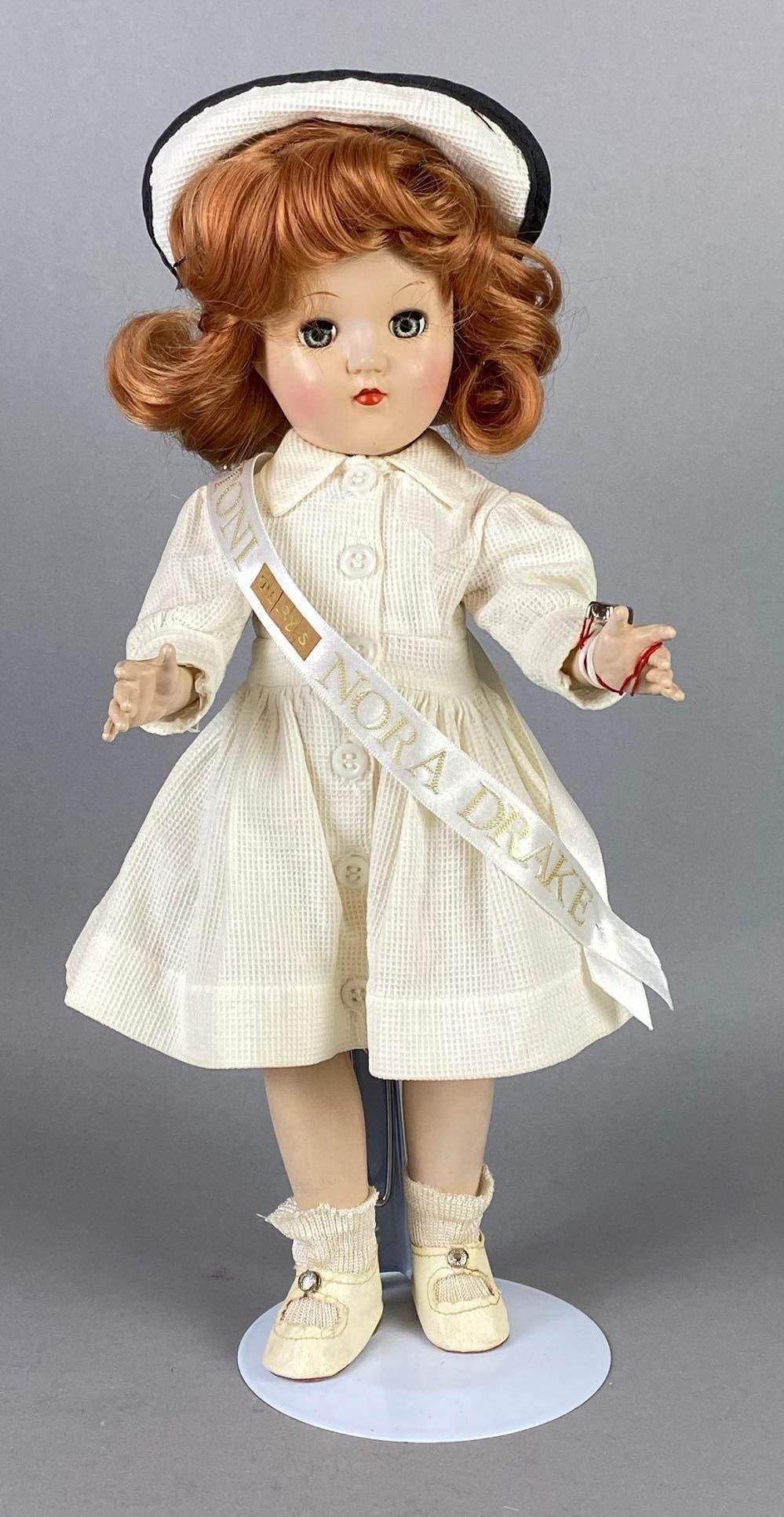 Vintage Ideal Toni Plays Nora Drake Red Hair Doll: Blue-Grey sleepy eyes, Doll stand included, Doll measures 14 1/4 inches tall.
