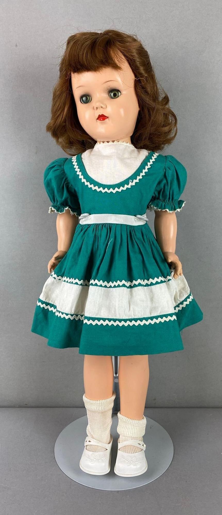 Vintage Ideal Toni P-93 Brunette Doll: Green sleepy eyes. Measures 19 inches tall.