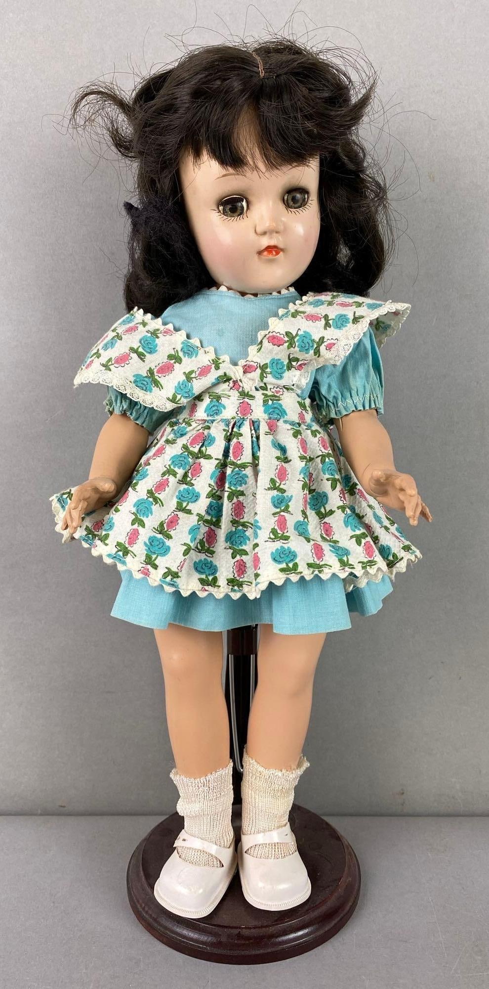 Vintage Ideal Toni P-90 Brunette Doll: Sleepy hazel eyes. Includes stand. Measures 14 1/2 inches tall.