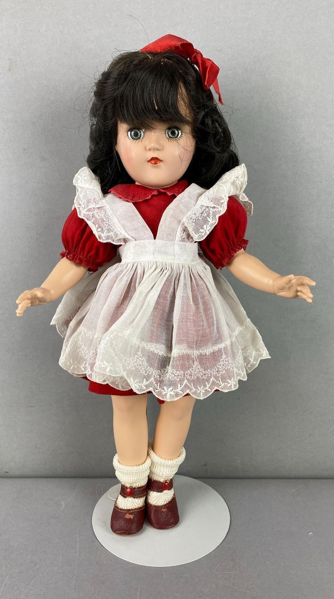 Vintage Ideal Toni P-90 Brunette Doll: Green sleepy eyes. Includes stand. Measures 14 1/2 inches tall.