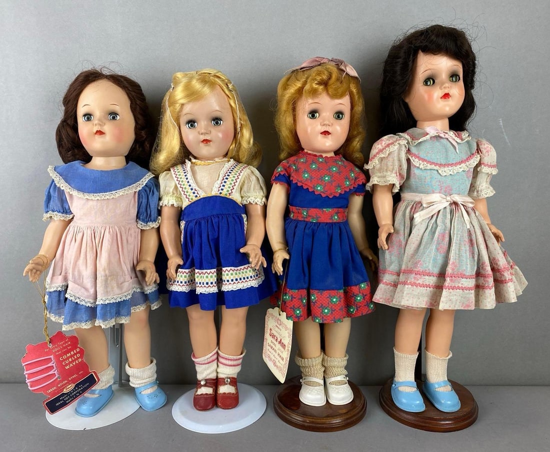 Group of 4 Vintage Ideal Toni P91 Dolls: Includes 2 blue sleepy eyes and 2 green sleepy eyes. 2 blonde and 2 brunette. Includes stands. All fingers are intact. Both tags are reproductions. Largest measures 16 1/2 inches Tall.
