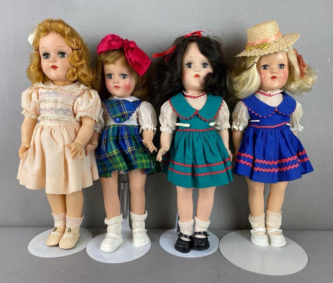 Group of 4 Vintage Ideal Toni P90 Dolls: All green sleepy eyes. Includes 3 blinde and 1 one brunette. All fingers are intact. Includes 2 stands and an extra dress. Largest measures 15 1/2 inches tall.