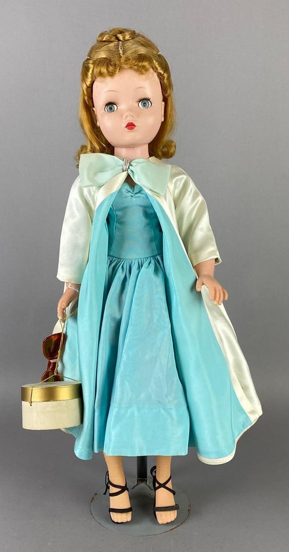 Vintage Madame Alexander Cissy Plastic and Vinyl Doll: Alexander 1955-1959, Original tagged clothes, original hat box, original sunglasses, original hairset, original shoes, Replaced slip and stockings, Left knee repaired and will not bend, Blue sleepy ey