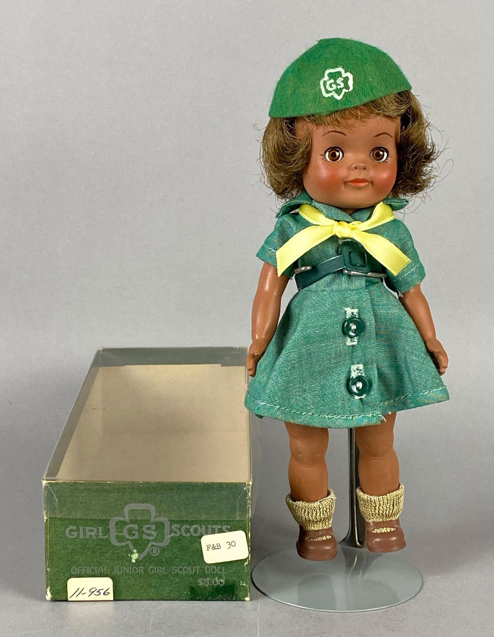 Effanbee Girl Scouts Official Junior Girl Scout Doll with Original Box: Brown sleepy eyes, Doll stand not included, Box measures 9 x 3 1/2 x 2 1/4 inches, Doll measures 8 3/4 inches tall.