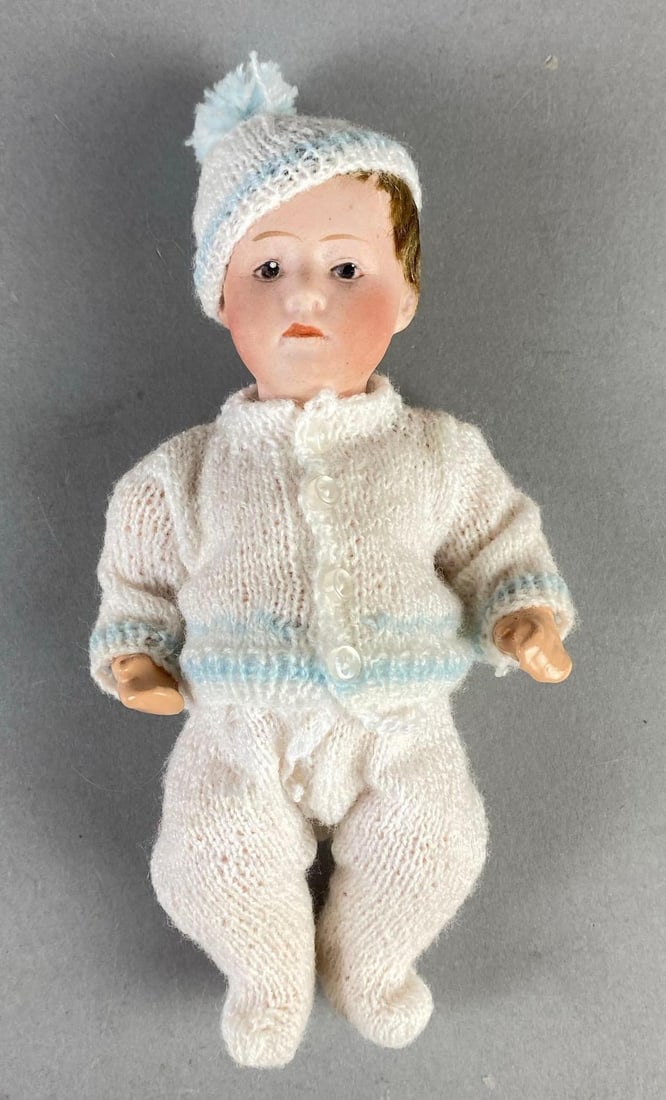 Antique German Porcelain Bisque Baby Doll: Porcelain head with composite body and limbs, Makers mark on back of neck, Doll measures 6 1/2 inches tall.