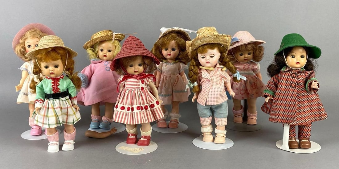 Group of Nancy Ann Storybook Dolls and More: Some dolls unmarked, All with sleepy eyes, Doll stands included, Some loose or missing limbs, Tallest doll measures 7 1/2 inches tall.