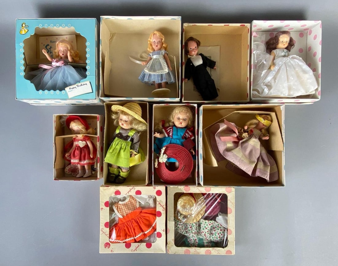 Group of Nancy Ann Storybook Dolls and More: In original boxes, Includes 8 dolls, and 2 outfit boxes, Some tears in boxes, Includes bride, groom, happy birthday, and more, Largest box measures 7 x 7 x 3 inches, Tallest doll measures 7 inches tal