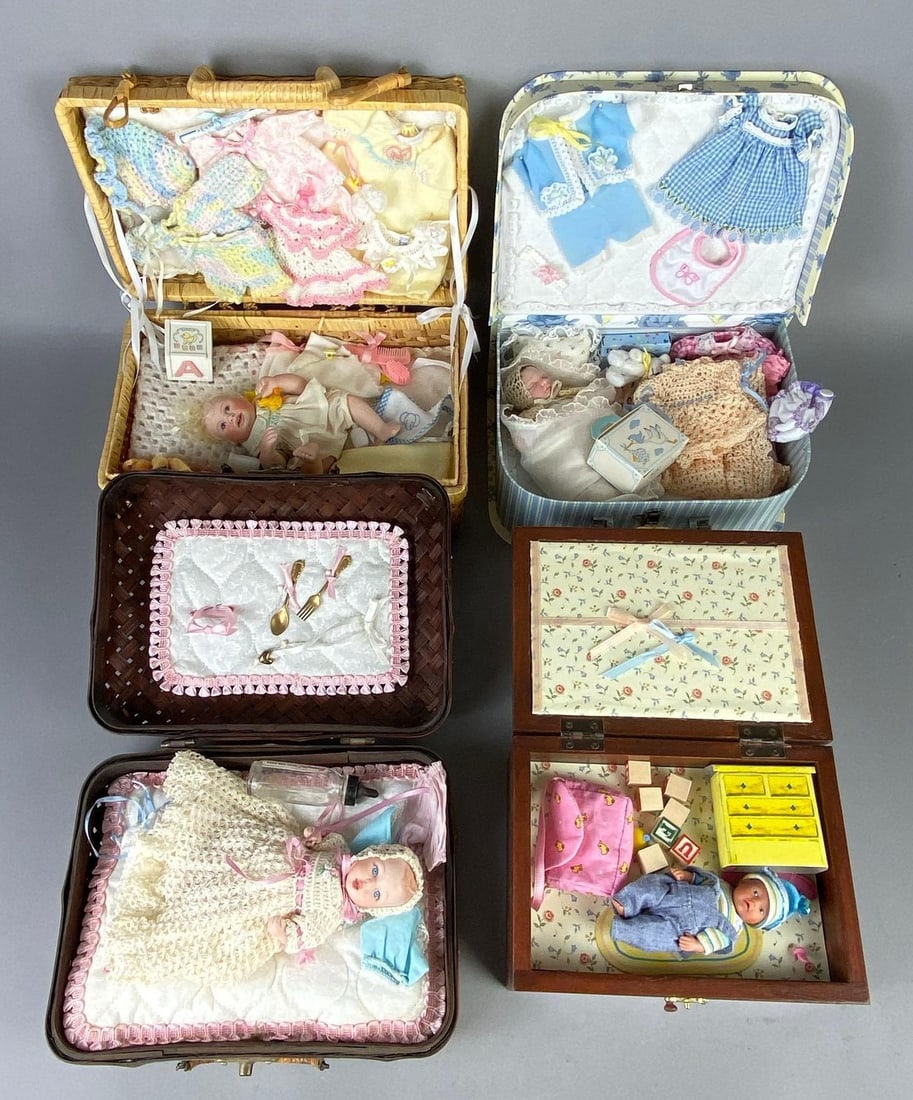 Group of 4 Porcelain and Vinyl Basket Baby Dolls: Includes 3 Porcelain, and 1 vinyl, Largest box/basket measures 8 1/2 x 11 x 5 inches, Largest doll measures 7 1/4 inches tall.