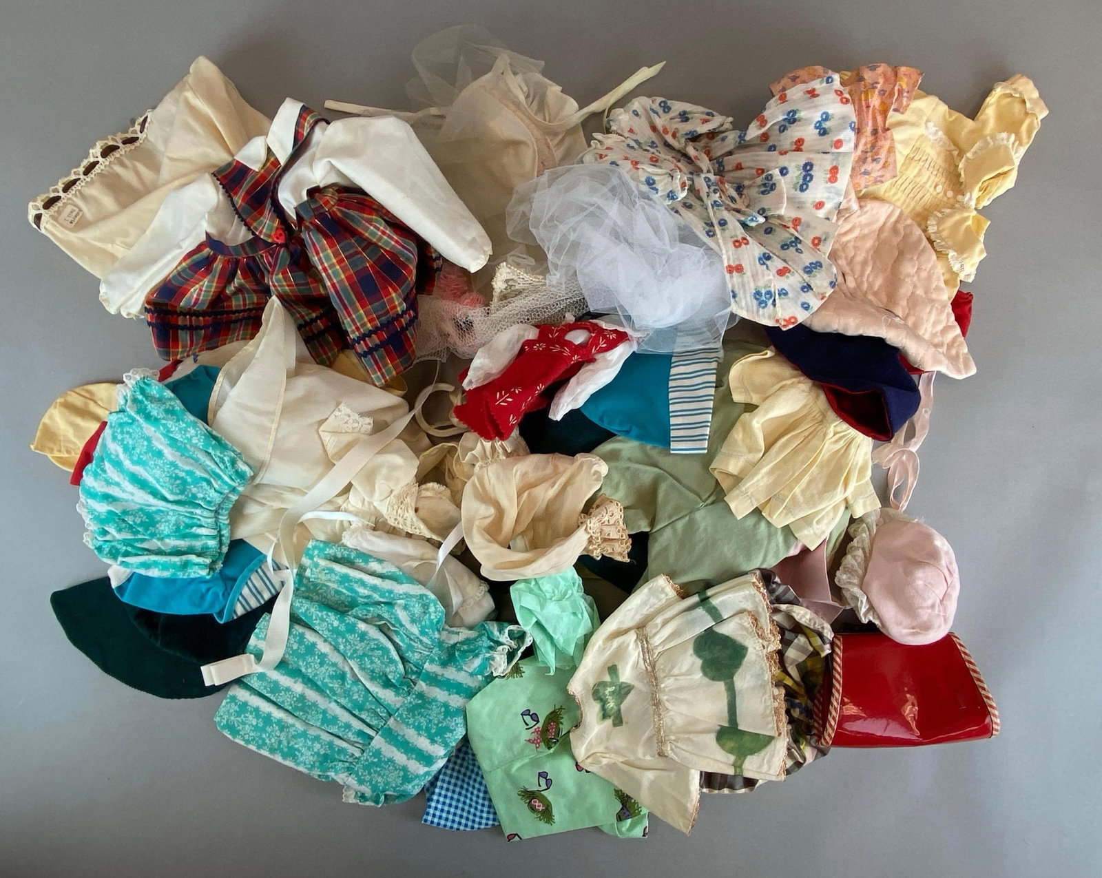 Group of Assorted Vintage Doll Clothing: Includes mostly ideal brand, includes dresses, shirts, beach outfit and more, largest measures 16 x 9 inches