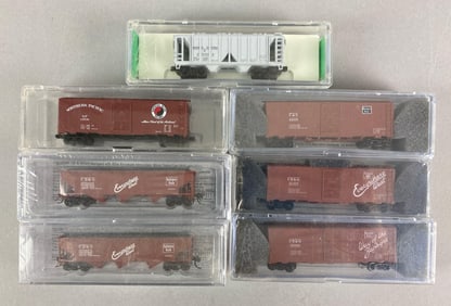 Group of N Scale Model Train Box Cars