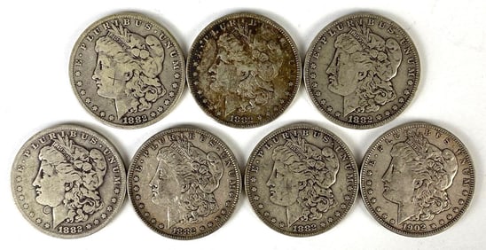 Group of 7 US $1 Morgan Silver Dollars