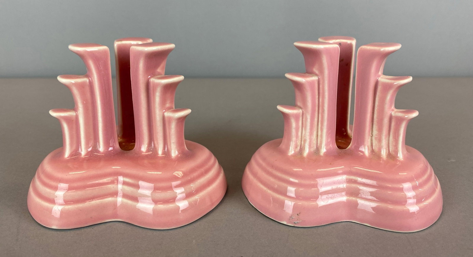 Group of 2 Fiesta Pink Art Pottery Candlesticks: Both marked on base, each measures 3 1/2 x 4 x 4 1/2 inches