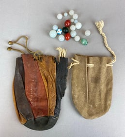 Group of Marbles with Vintage Leather Marble Bags
