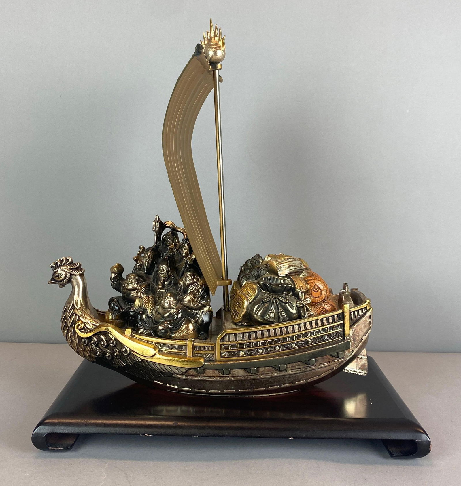 Japanese Lucky Treasure Ship With Display Stand: Ship made of Metal, Some scuffs shown on display stand, measures 16 x 13 x 9 3/4 inches