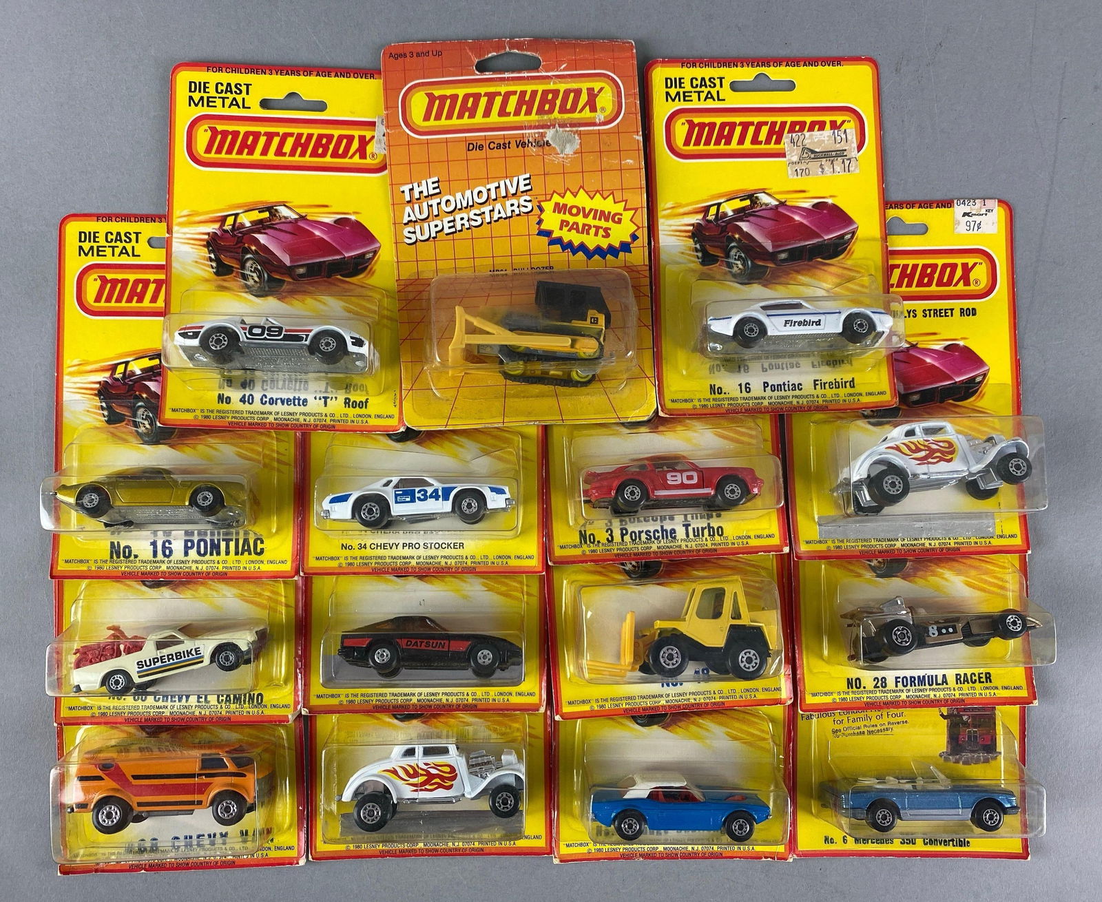 Group of Matchbox Die-Cast Vehicles: Includes No. 64 bulldozer, No. 16 Pontiac Firebird, No. 34 Chevy Pro Stocker and more, like new in original packaging
