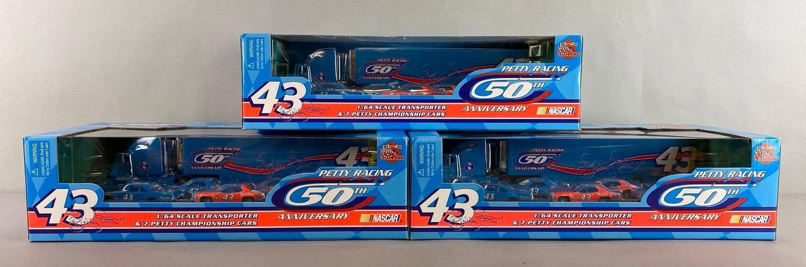 Group of 3 Racing Champions Petty Racing Die-Cast Transporter and 7 Cars: Transporter is 1/64 scale. 50th Anniversary