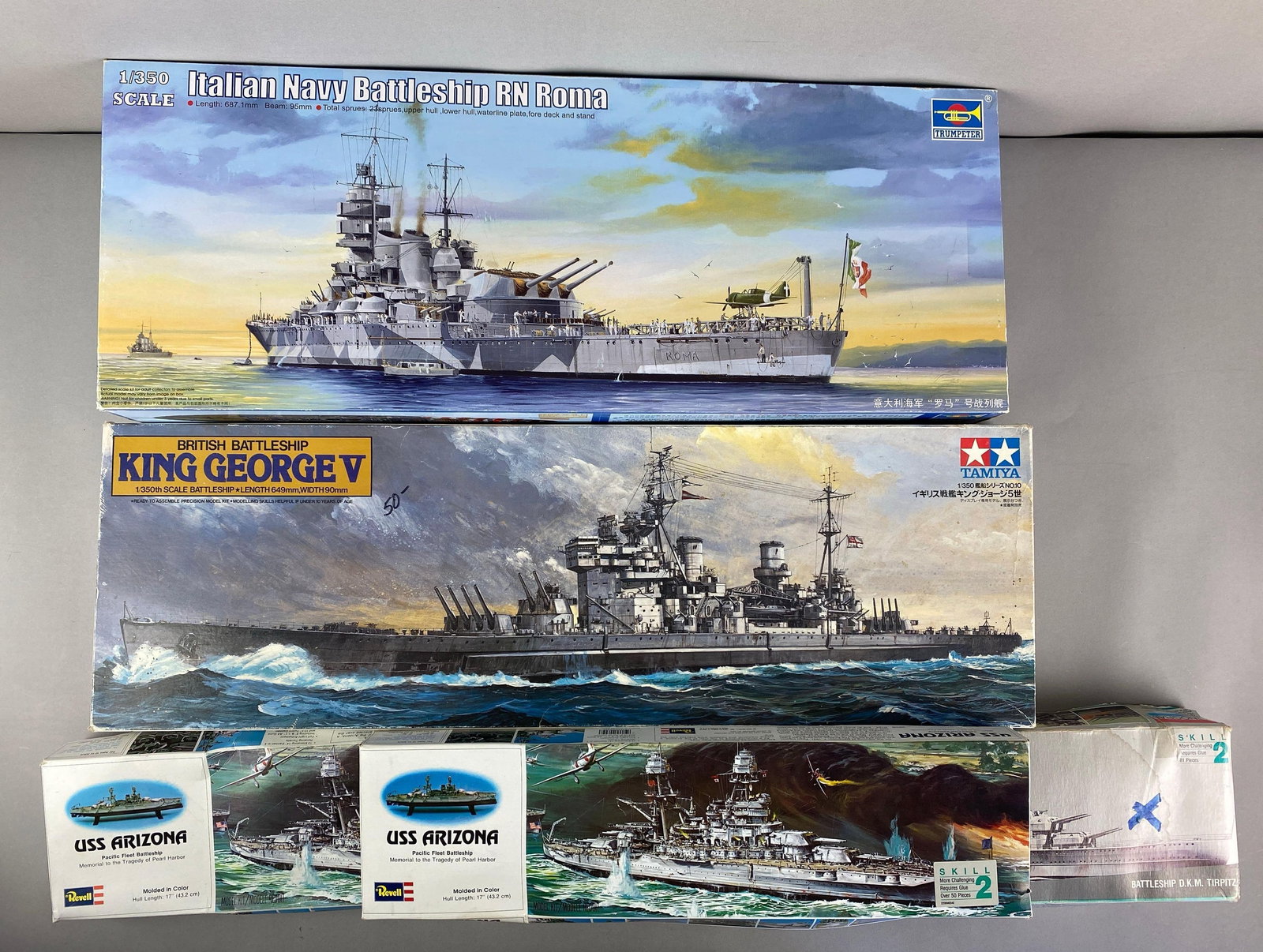 Group of Naval Battleship Plastic Model Kits: Includes Italian Navy battleship RN Roma, sealed British Kikg George V, USS Arizona and battleship DKM Tirpitz, all in original boxes, sets seem complete, largest is 1 / 350 scale