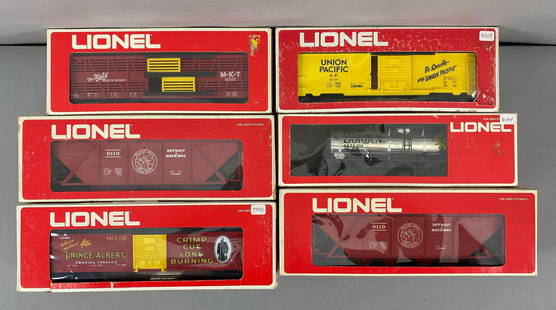 Group of 6 Lionel O Scale Train Cars: All in original boxes, includes Prince Albert Box car, Detroit and Machinaw covered hopper, Borden Plated Tank Car and More, longest measures 12 inches in length