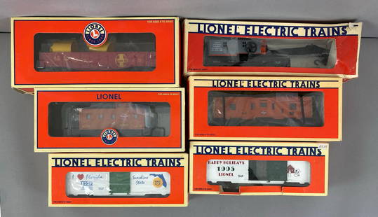 Group of 6 Lionel O Scale Train Cars: All in original boxes, Includes I love Florida Box Car, Lionel Christmas box car 1995, 1985 LCCA crane car and more, some damage shown to boxes, longest measures 13 inches in length