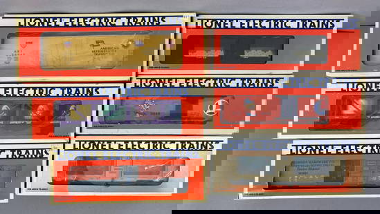 Group of 6 Lionel O Scale Train Cars: All in original boxes, includes animated aquarium boxcar, Lionel Lines Box car, Carson city mint car and more, longest measures 12 1/2 inches in length measures