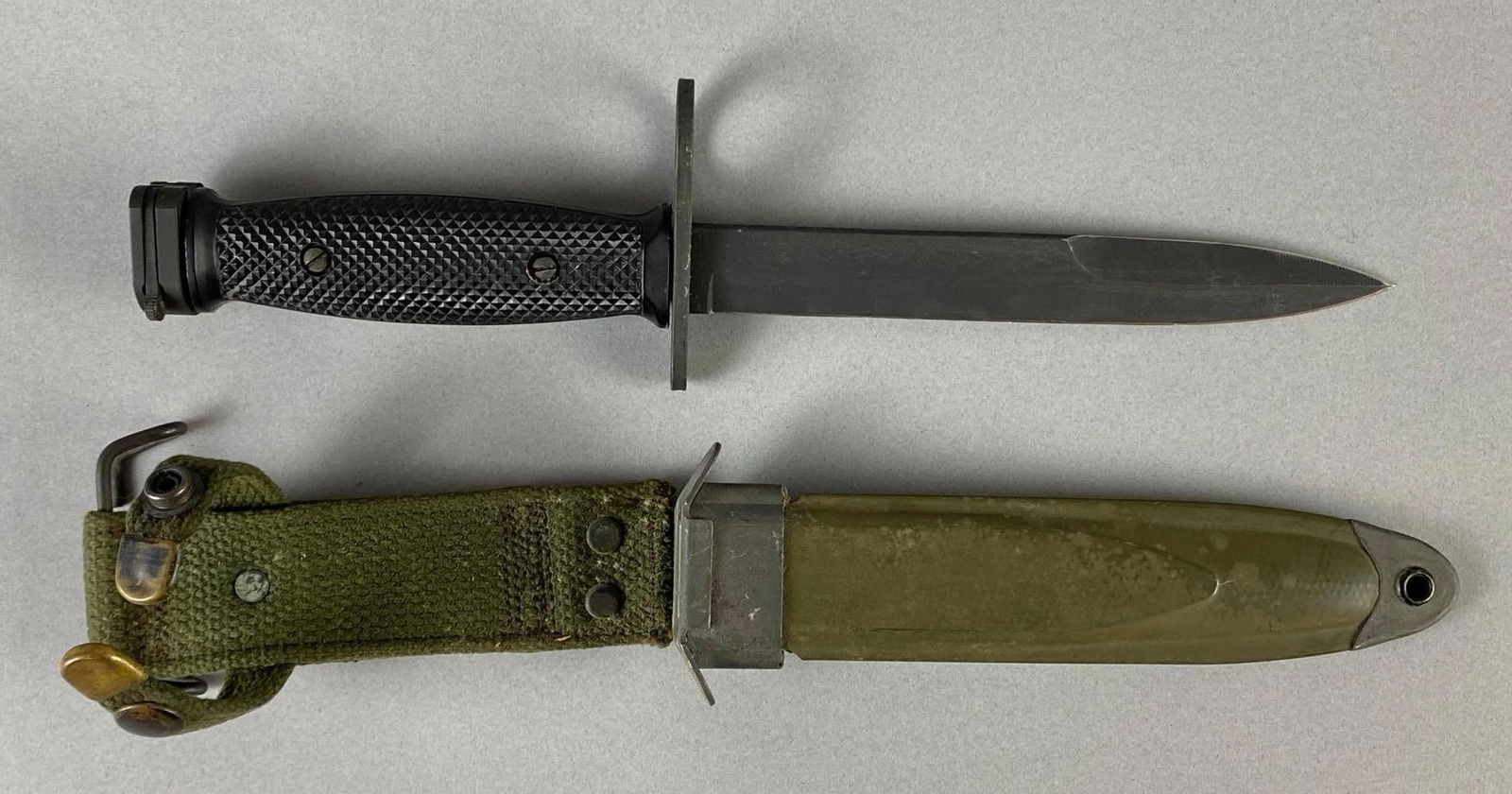 US Military M7 Imperial Bayonet with Sheath: Bayonet measures 12 inches long, Blade measures 6 3/4 inches long.