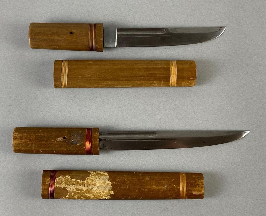 Group of 2 Japanese Tanto Daggers with Wood Sheaths: These 2 knives were found on the island of Saipan on bodies of Japanese troops who were expected to commit hara-kiri, Longest dagger measures 10 inches long, Blade measures 6 1/2 inches long.