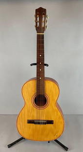 1965 Giannini Model 6 Acoustic Guitar with Case: Stand not included. Some scratches and wear, neck is rough, measures 38 inches, 12 inch neck