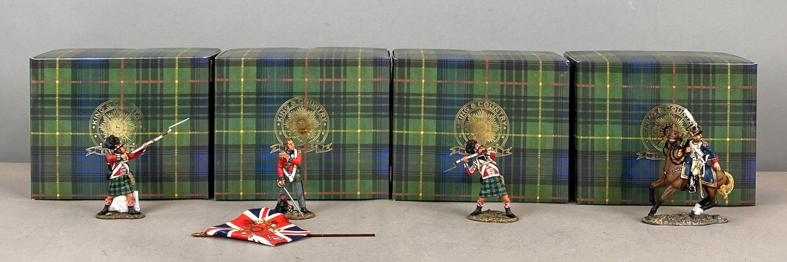 Group of 4 King and Country Age of Napoleon Painted Metal Figurines: Includes Scottish highlanders and Officer on Horse, in original boxes, tallest measures 3 3/4 inches