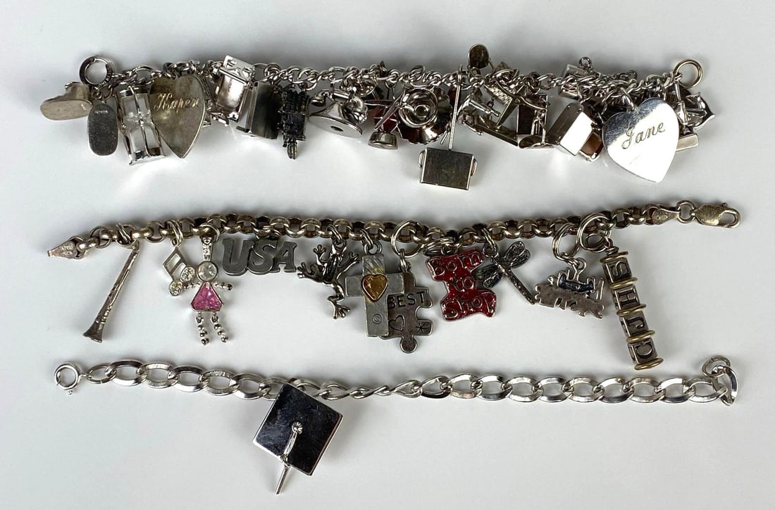 Group of 3 Sterling Silver Charm Bracelets with Charms: Includes phone, hearts, instruments, hourglass, and more, Longest bracelet measures 7 inches long.