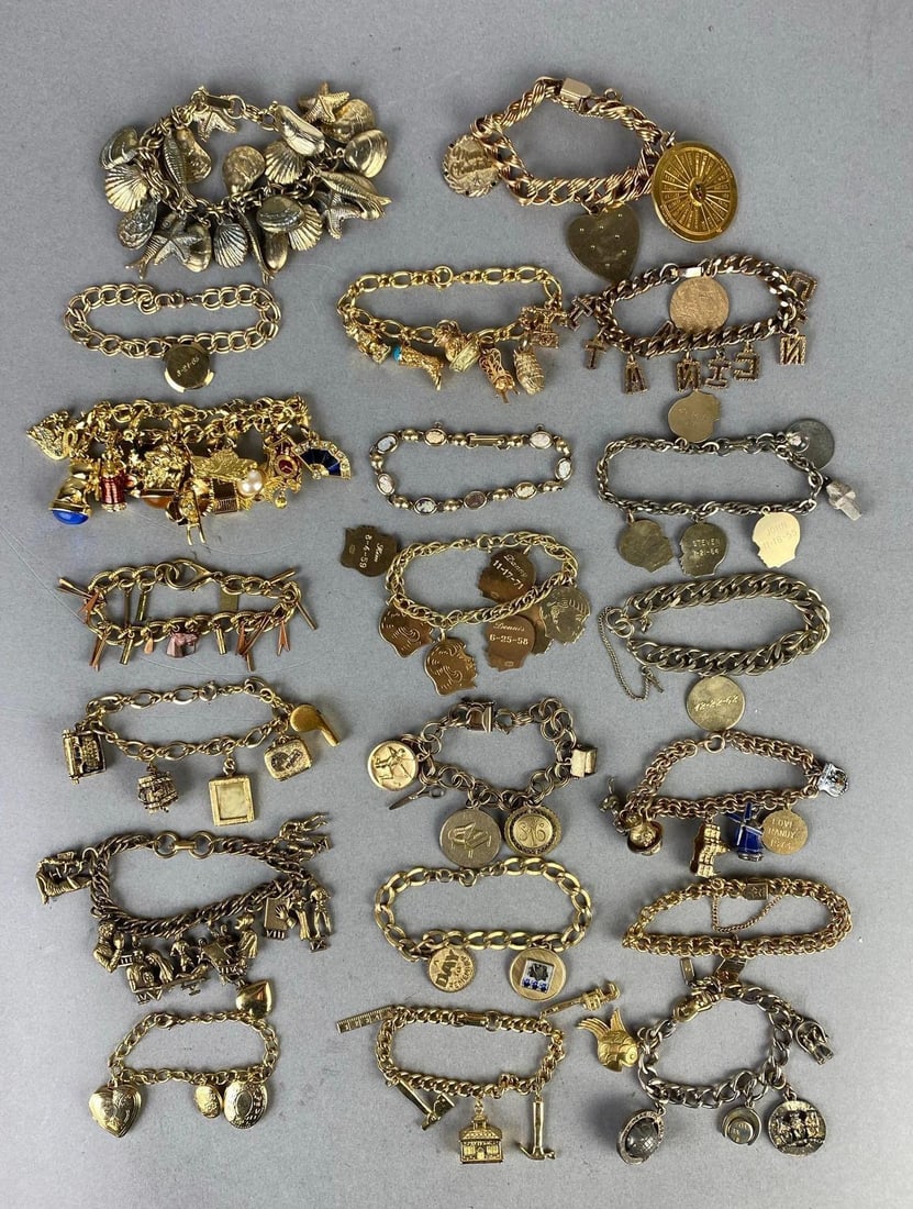 Group of Gold-Filled and Costume Jewelry Charm Bracelets: Includes seashells, portraits, travel, letters, and more, Longest bracelet measures 7 inches long.