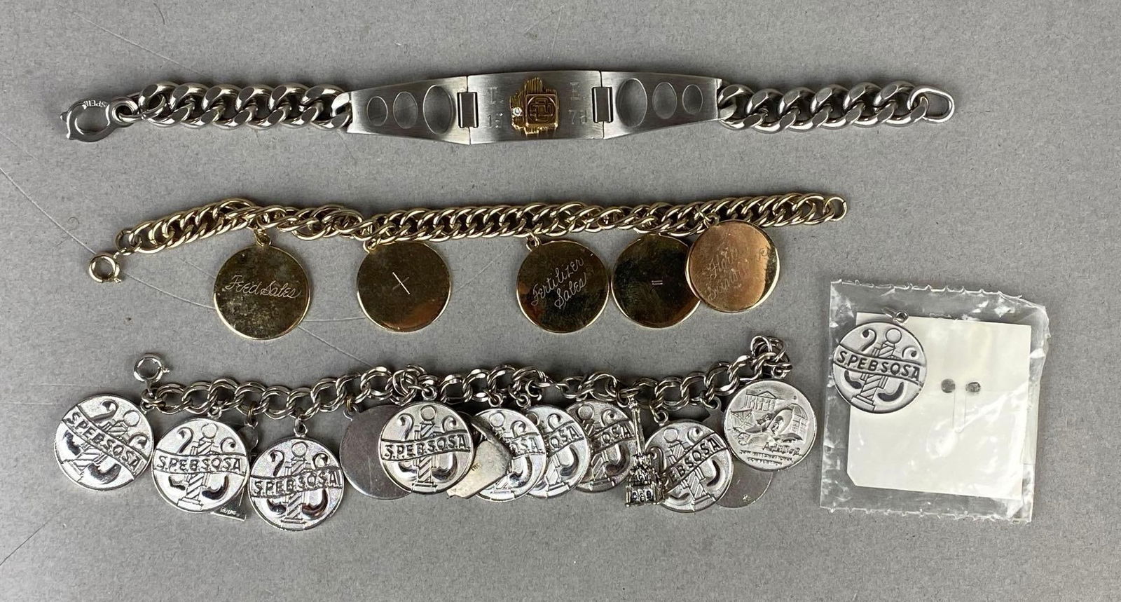 Group of 3 Charm Bracelets and More: Includes some sterling, Includes SPEBSOSA, engraved, and other, Longest bracelet measures 8 1/4 inch.