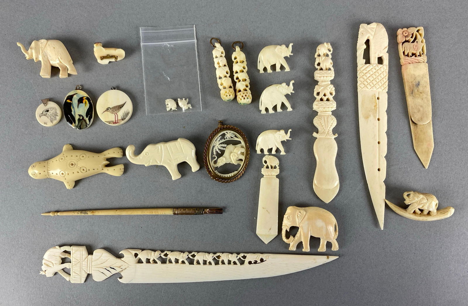 Group of Assorted Bone Pins and More: Includes Earrings, pendants, letter openers and more, largest measures