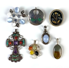 Group of 7 Sterling Silver Brooches and Pendants