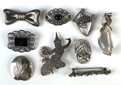 Group of 9 Sterling Silver Brooches and Necklace Pendants