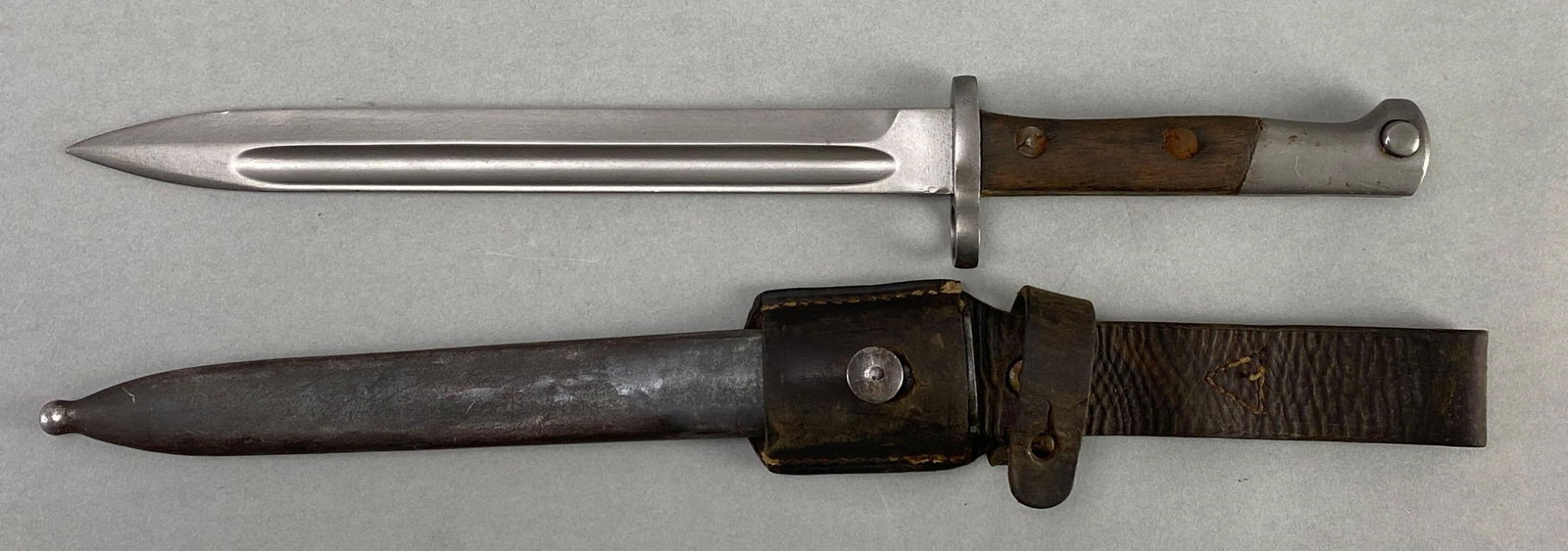 Yugoslavian M1924 Mauser Bayonet with Scabbard: Measures 15 inches in length with a 9 inch blade
