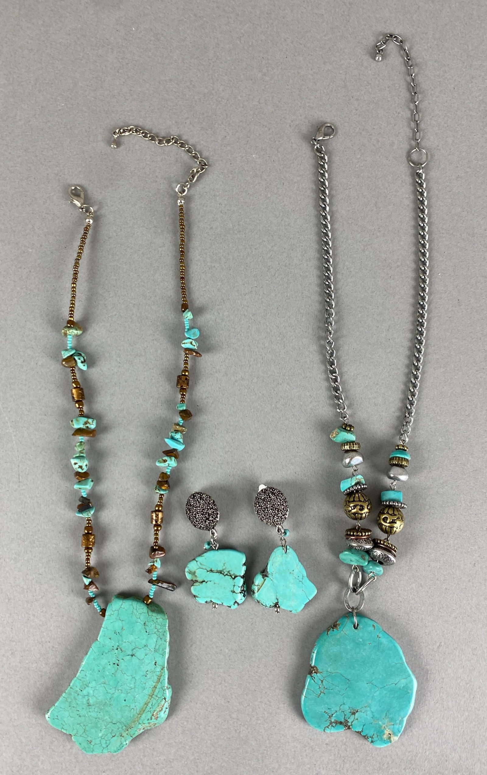 Group of Turquoise Cross Section Jewelry: Includes pair of earrings and 2 necklaces, longest measures 26 inches in length