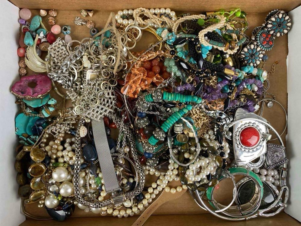 Group of Assorted Costume Jewelry: Includes necklaces, earrings, charm bracelets and more