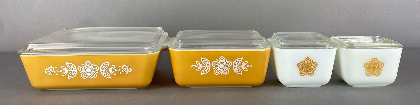 Set of 4 Pyrex Butterfly Gold Glass Refrigerator Dishes: all marked on base, largest measures 9 3/4 x 7 x 3 1/2 inches